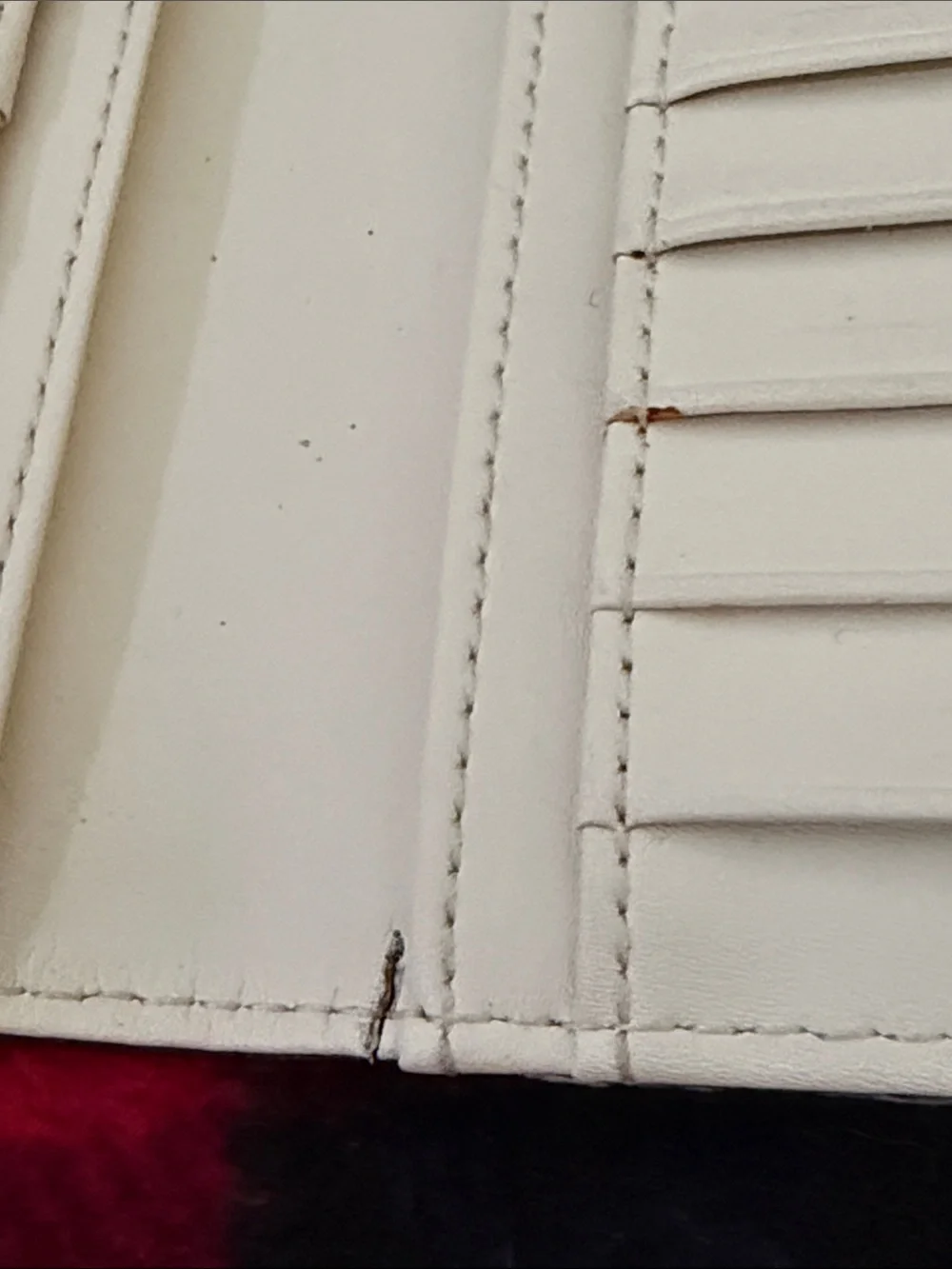 Kate Spade New York Staci large slim bifold wallet in a red currant shade